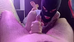 Girl in mask blows lazily