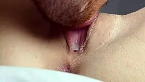 Wet pussy licked to orgasm in close-up view.