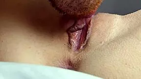 Wet pussy licked to orgasm in close-up view.