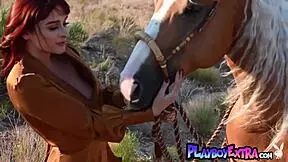 Petite Redhead Odette Fox With Big Natural Tits Strips To Show Pussy On Horseback.