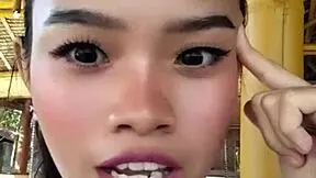 Petite beauty shows off huge dildo, teasing first time use