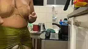 hey, check this chick flashing her swollen pussy in a mini skirt during a kitchen live stream
