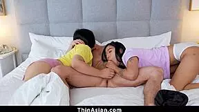 Hey, sharing this bed with my Asian girlfriend and her stepmom gets wild with blowjobs.