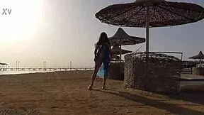 No panties on the public beach, sexy young girl!