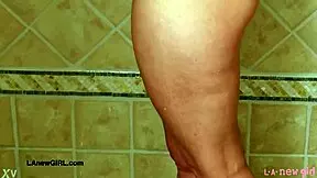 The aspiring teen model stepped into the shower after her photoshoot session on the sofa.