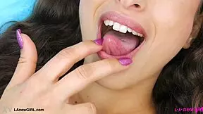 mesmerizing brunette beauty shows her stunning body during a photoshoot on the sofa