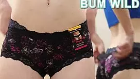 A young teen models sexy lingerie and panties in a nude setting.