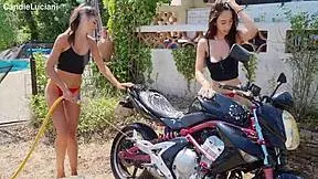 Cute biker gets muff dived during wash.