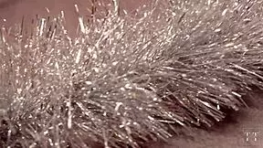 Asian slut covered in cum on christmas. tattooed body glistens wetly.