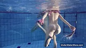 Horny girls strip each other in the pool, don't they?