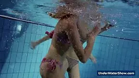 Horny girls strip each other in the pool, don't they?