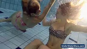 Horny girls strip each other in the pool, don't they?