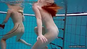 Look At These Two Hot Lesbians In The Pool, Shaved And Sexy With Natural Tits Underwater!
