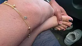 i touch her feet and ass in public street while she rests in my car.