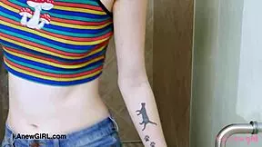 Elegant shy model enjoys a sensual bath during photoshoot