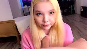 A charming student gently caresses an adult man's cock in a homemade setting.