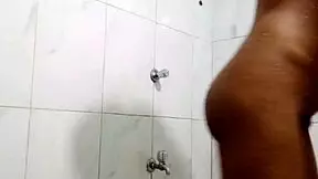 Desi indian teen pisses indoors during bath.
