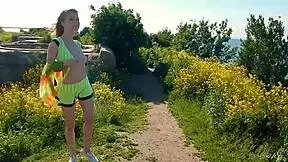 Spunky teen model strips naked outdoors for photoshoot?