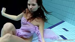 Aneta flaunts big tits in purple pool dress!