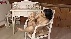 Brunette babe puts oil on her sexy feet in dollscult video