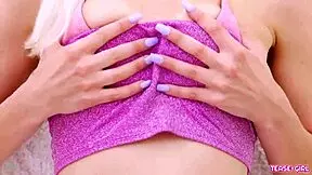 radiant blonde girl poses in photoshoot on sofa