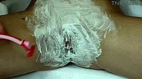 Watch this slut shave her hairy pussy close up with trimmer and razor!