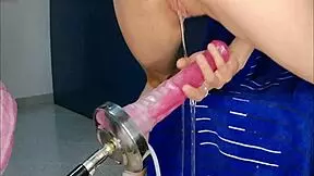 The Huge Monster Dildo Stretches Petite Lola Spice's Pussy, Making Her Squirt On The Fucking Machine.