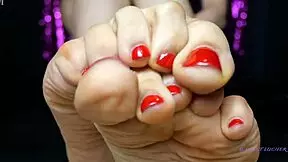 Small feet mistress with red toenail polish dominates sensually, sweat glistening