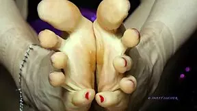 Small feet mistress with red toenail polish dominates sensually, sweat glistening