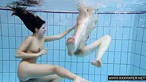 Shaved brunette with big tits underwater?