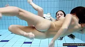 Shaved brunette with big tits underwater?