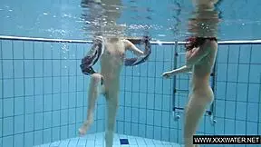 Shaved brunette with big tits underwater?