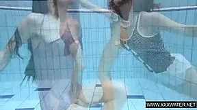 Shaved brunette with big tits underwater?