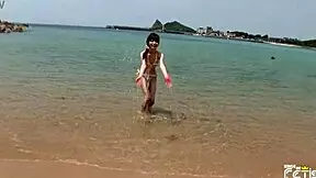 Skinny japanese chick enjoys having a photoshoot on the beach 😊