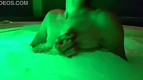 petite girl playing naked in the outdoor jacuzzi pool