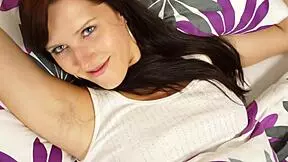 Innocent brunette teen feels naughty pleasure in her bedtime solo orgasm