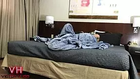 Couple relaxes in a hotel room.