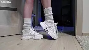Delicate legs in sneakers are waiting for you