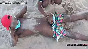 Young couple engages in wet foreplay and sex on the beach with friends watching