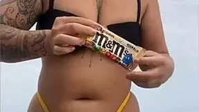 young african girl wears tight yellow bikini splitting swollen pussy to attract attention on usa beach