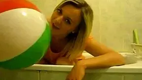 Sophie masturbates with balloons in the living room and bathroom, fingering her wet pussy