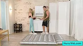 sexy blonde intensely pours nuru gel and rubs tits on client