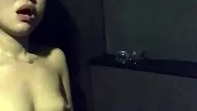 asian wife masturbates with dildo and vibrator in gym shower