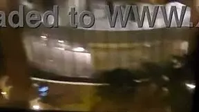 woman relaxing in public near hotel window