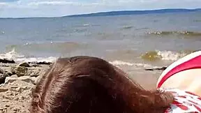 beautiful brunette gives intense blowjob by the river