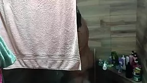 i arrived at my aunt's house and found her in the shower masturbating, almost catching me watching