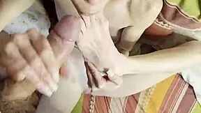 Petite beauty sucking cock and toes simultaneously – a tantalizing contrast.