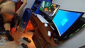 Teen plays video games while getting intimate.