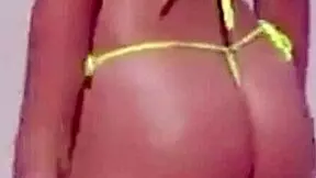 Can you believe this young girl in a micro bikini on the beach with her boyfriend's relatives?