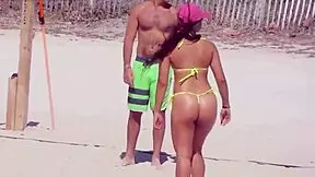 Can you believe this young girl in a micro bikini on the beach with her boyfriend's relatives?